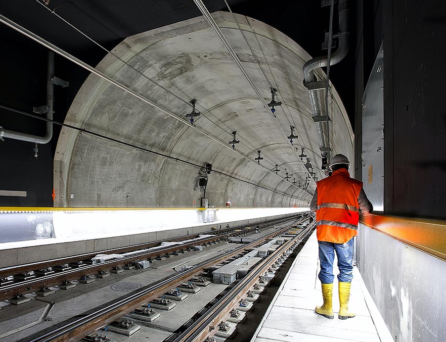 Worker examining railroad condition